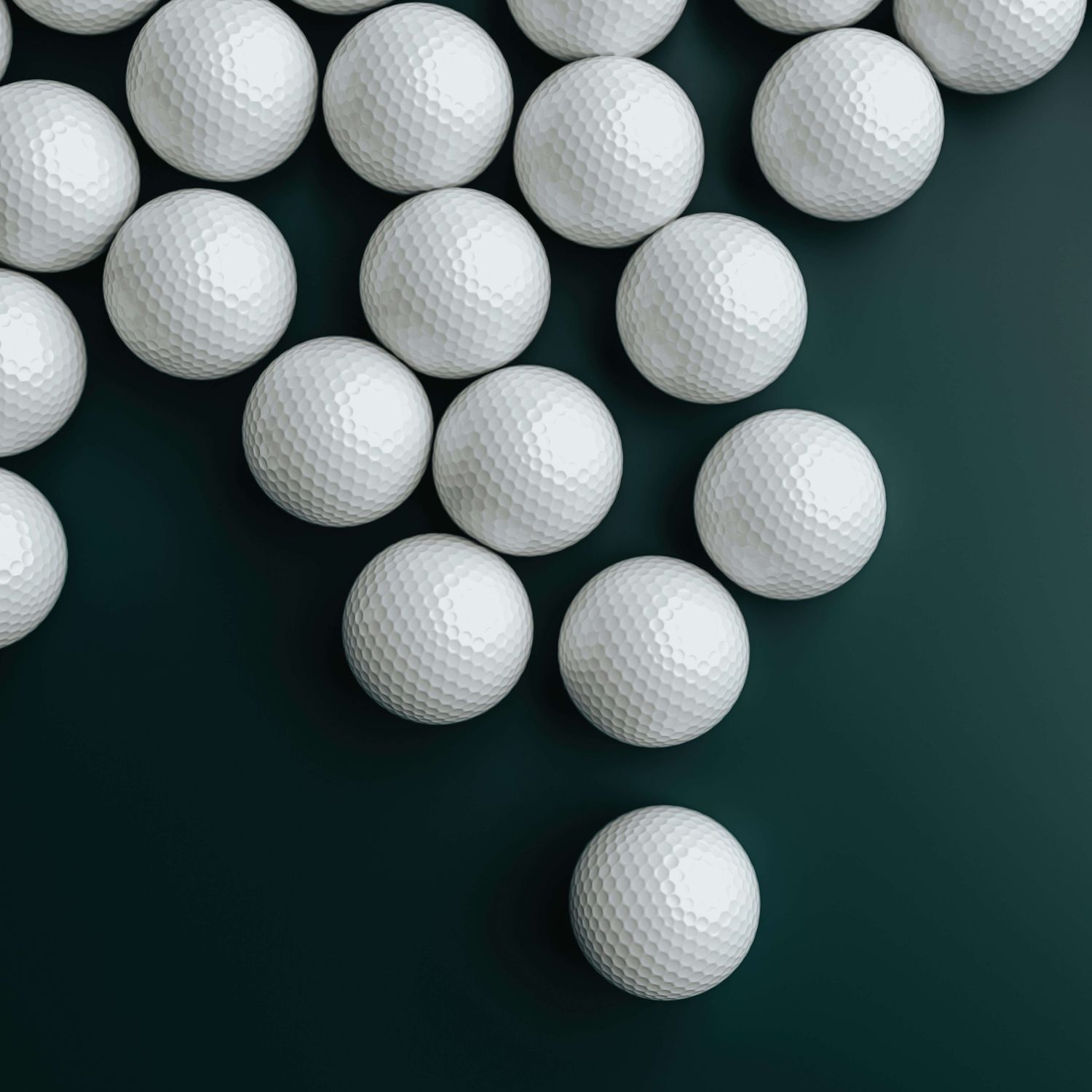 Golf balls on a dark blue surface